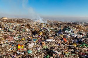 Burning trash piles in landfill