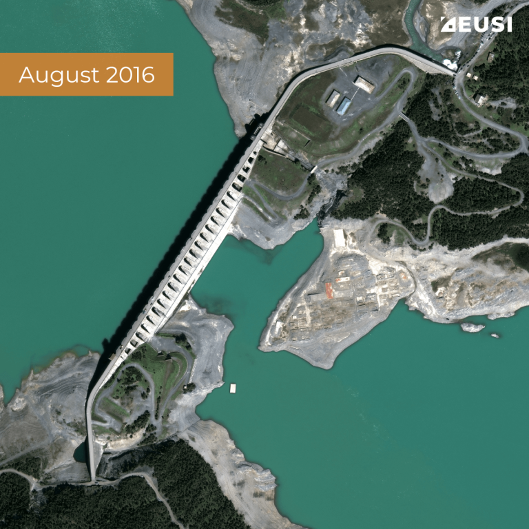Satellite image of a dam between two water reservoir, collected in August 2016 with mid-high water level