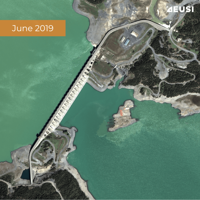 Satellite image of a dam between two water reservoir, collected in June 2019 with high water level