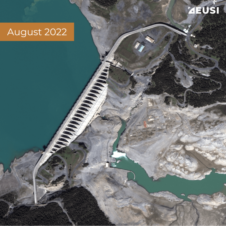 Satellite image of a dam between two water reservoir, collected in August 2022 with low water level
